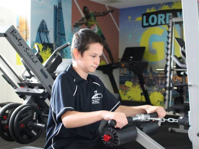 A student working hard in the school's new gym.