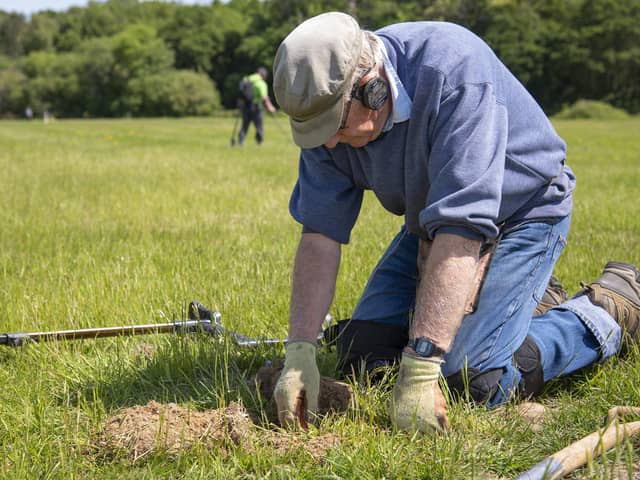 The team search the site for any hidden treasures