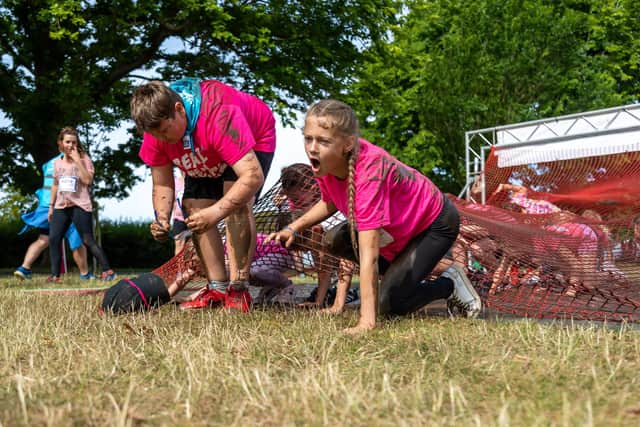 Getting dirty at the Pretty Muddy kids race. Picture: Mike Cooter (020722)