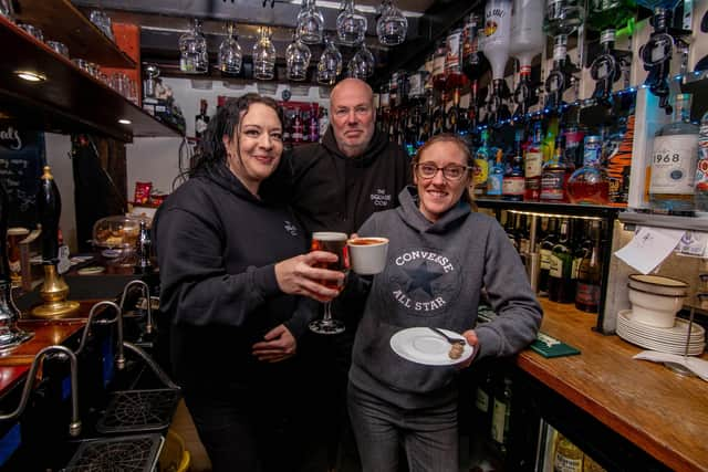 Square Cow, Wickham Square, Wickham, has adapted by turning into a coffee house as well as a pub, due to the cost of living crisis. Pictured: Owner Frank Dixie with assistant manager,Natasha Lipscombe and Kerry Neale, head chef at Square Cow Wickham Square on Wednesday 14th December 2022. Picture: Habibur Rahman