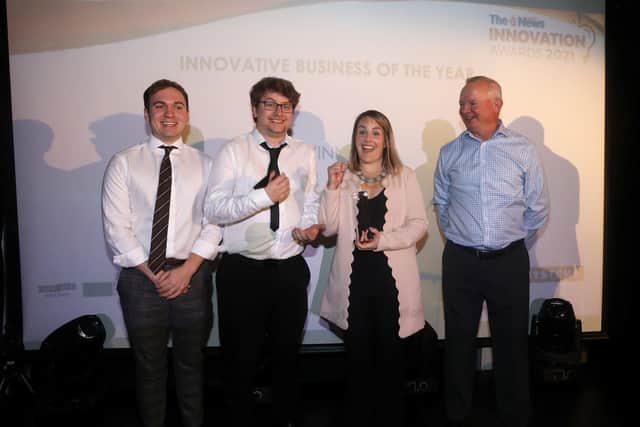 Chris Fisher, Alex Higgs and Sam Cole from Datavault pick up the award of Innovative Business of the Year from Derek Ellis of sponsor GetSet Solent at The News Innovation Awards 2021 Picture: Sam Stephenson