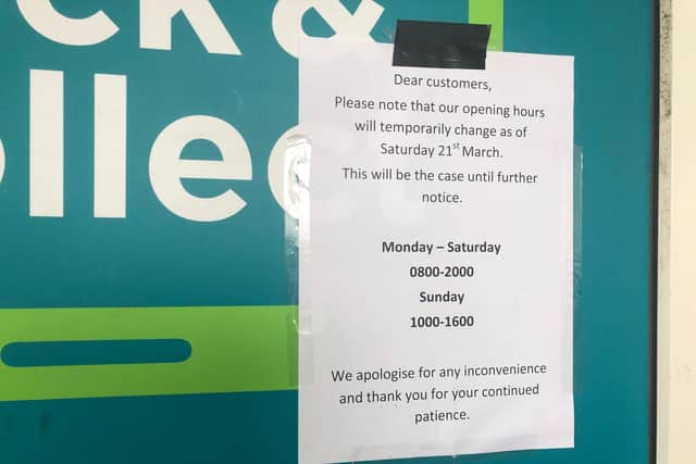 Sign outside Asda in Fratton notifying shoppers of reduced hours.