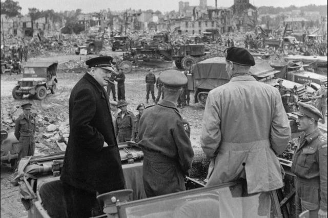 (From left) British Prime minister Winston Churchill, Sir Miles Dempsey, British 2nd Army commandant, and British general Marshal Bernard Montgomery visit destroyed city of Caen, 23 July 1944 after Allied forces stormed the Normandy beaches on D-Day. D-Day, 06 June 1944 is still one of the world's most gut-wrenching and consequential battles, as the Allied landing in Normandy led to the liberation of France which marked the turning point in the Western theater of World War II. (Photo credit should read STF/AFP/Getty Images)