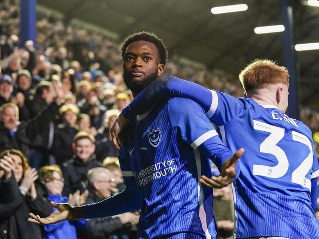Abu Kamara receives the fans' adulation after he put Pompey 3-1 up against Cambridge United