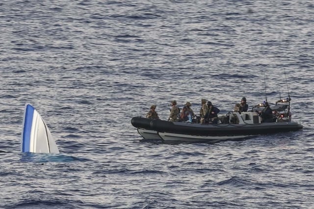 HMS Dauntless conducting a drugs intervention/rescue mission whilst operating in the Caribbean region.