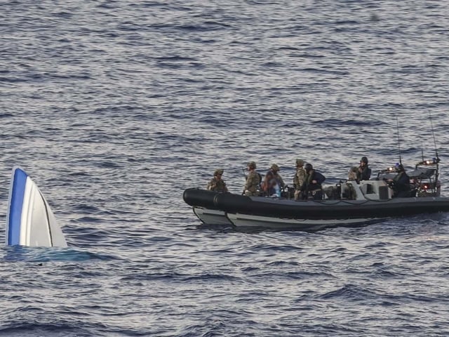 HMS Dauntless conducting a drugs intervention/rescue mission whilst operating in the Caribbean region.