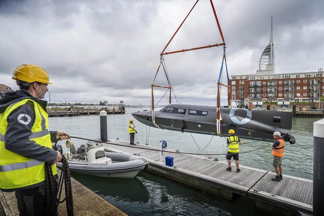 The Victa craft made by SubSea Craft is lowered into the water at the Camber in Old Portsmouth