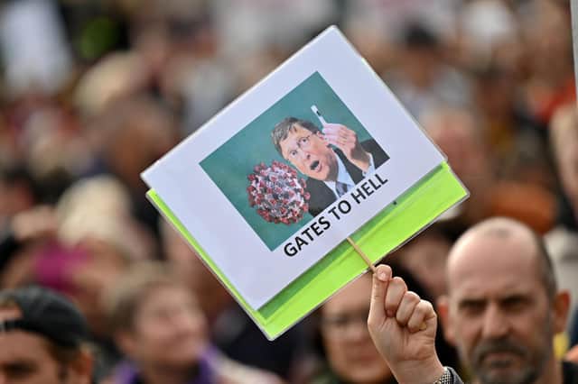 A protester holds up an anti-Bill Gates placard in Trafalgar Square in London on September 26, 2020, at a 'We Do Not Consent!' mass rally against vaccination and government restriction. Photo by Justin Tallis/AFP via Getty Images.
