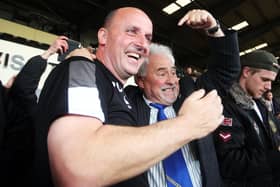 Iain McInnes, right, celebrates Pompey's promotion with then manager Paul Cook in 2017