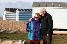 Bbeach hut owners David Flower, 84, and his wife Jacqueline Flower, 83, with their broken beach hut on Hayling Island sea front. They are pleading for help to repair it before it is  gone for good. Picture: Sam Stephenson.