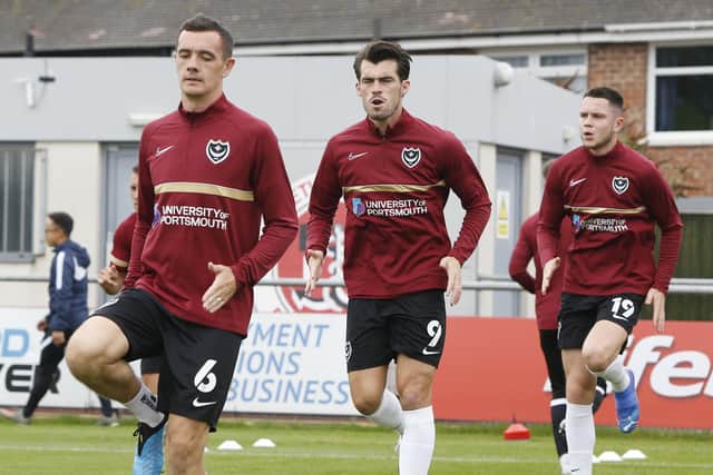 Shaun Williams, left, warms up ahead of the Fleetwood game with John Marquis and George Hirst.  Picture: Paul Thompson/ProSportsImages