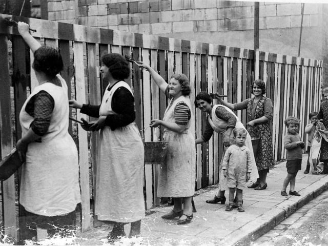 Getting ready for the King.Pictured in 1937 are ladies from Nile Street, Landport  painting a fence in the colours of the Union jack for the celebrations for the Coronation of King George VI in 1937.Sent in by George Warren of Horndean we see from left to right Mrs Lilly, Mrs sands, Mrs Russell and George's mother, Mabel.  Far right is George with his grandmother.