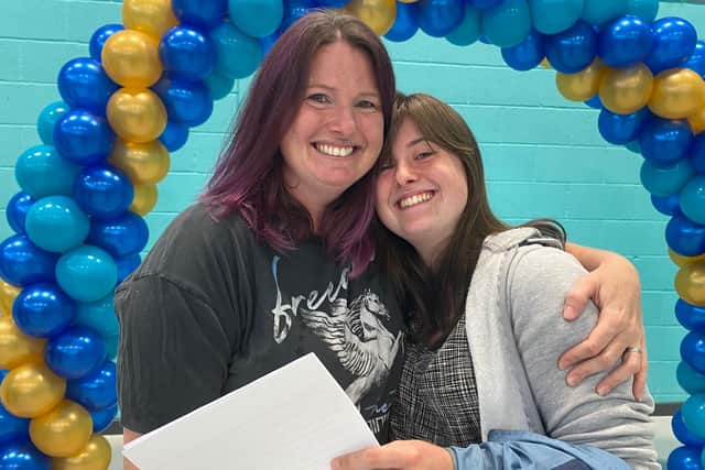 Right, Bethany Tyas, 15, is hugged by her proud mum, Samantha Tyas, as she collected her GCSE results at UTC Portsmouth. Photo: Tom Cotterill,