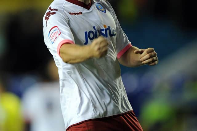 Carl Dickinson celebrates following Pompey's 1-0 triumph at Millwall in October 2010. Picture: Steve Reid
