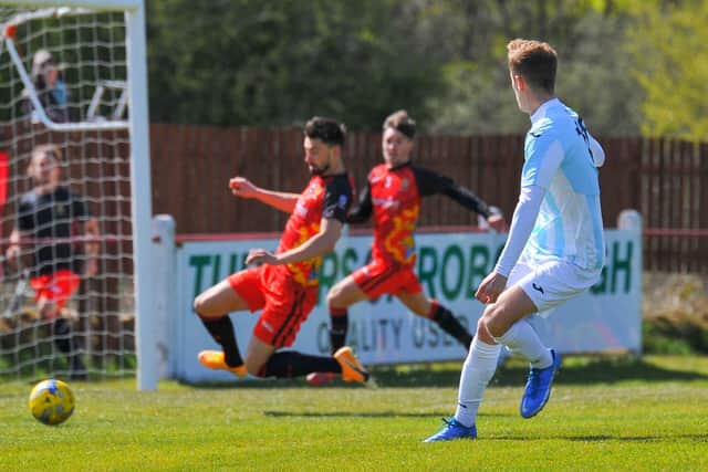 James Franklyn's third-minute shot is about to be cleared. Pic: Martyn White