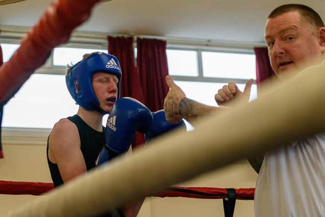 Waterloovile Boxing Club's Leo Easen gets a count from the referee. Picture: Vernon Nash