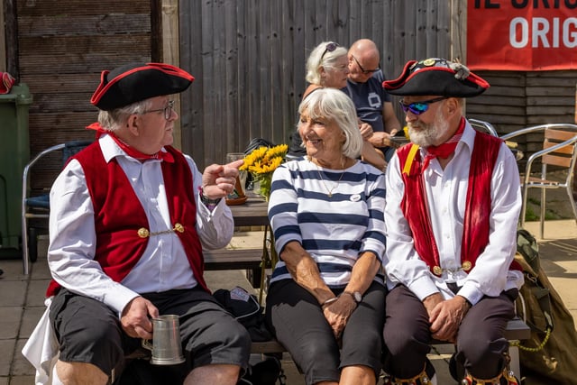 Attendees enjoy a drink in the sun at the Festival of Fun at The Lifeboat Inn, Hayling Island on Sunday, August 25. Picture: Mike Cooter (250824)