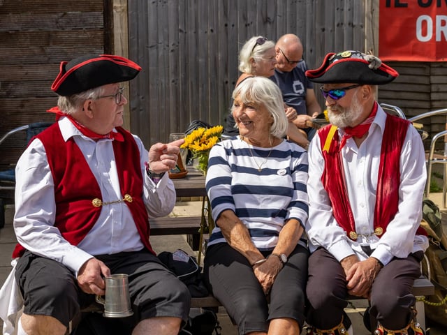 Attendees enjoy a drink in the sun at the Festival of Fun at The Lifeboat Inn, Hayling Island on Sunday, August 25. Picture: Mike Cooter (250824)