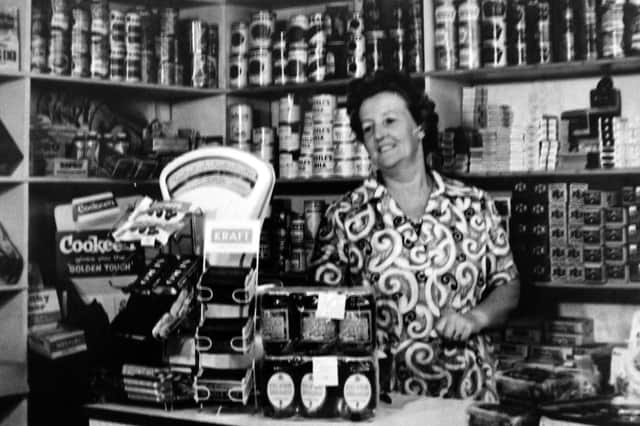 Ethel Morse behind the counter in her shop in Toronto Road, Buckland, Portsmouth. Picture: Tony Davis collection.