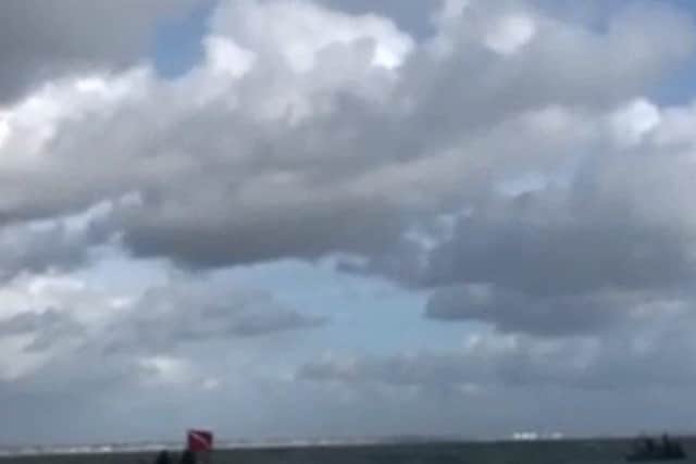 John Bream jumping from a helicopter into the Solent