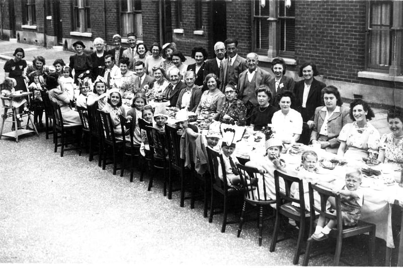 VE Day party. Residents of Silchester Road, Baffins, Copnor at their 'do' celebrating the end of the conflict in Europe in 1945.
sent in by Jacqueline Rayner nee Copping of Widley her brother Roger is to the front right with legs through the back of the chair and Jacqueline is to his left.  
Three of her cousins Janet and Heather,now resident in New Zealand and Wendy, now in South Africa are also in the picture.