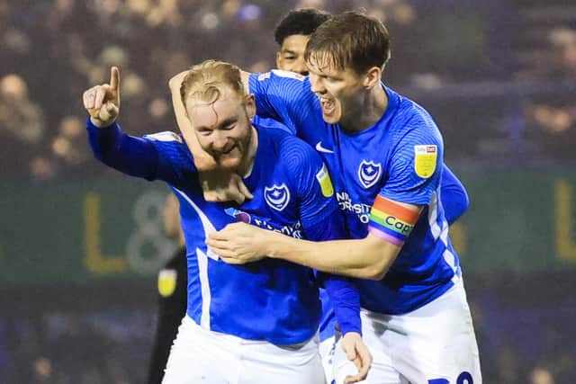 Connor Ogilvie is congratulated for his goal against Morecambe by defensive team-mate Sean Raggett. Picture: Barry Zee