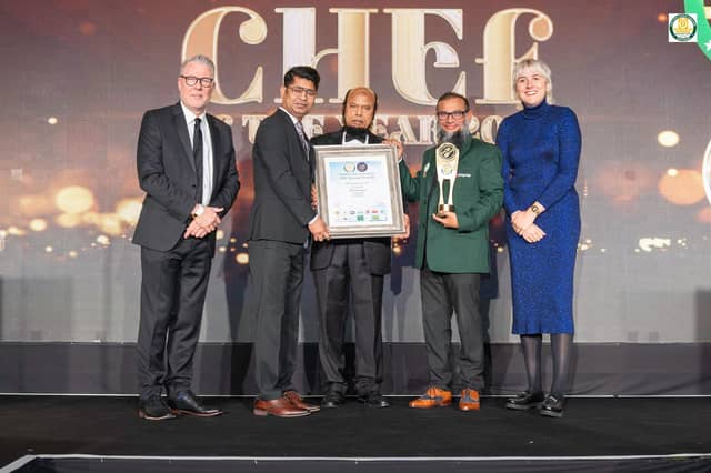 MG Farooque collecting his award