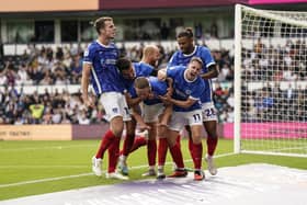 Pompey's players celebrate Colby Bishop's 95th-minute leveller at Pride Park. Picture: Jason Brown/ProSportsImages