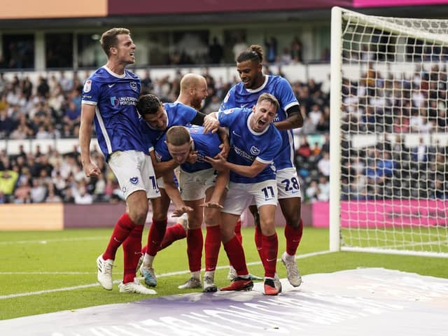 Pompey's players celebrate Colby Bishop's 95th-minute leveller at Pride Park. Picture: Jason Brown/ProSportsImages