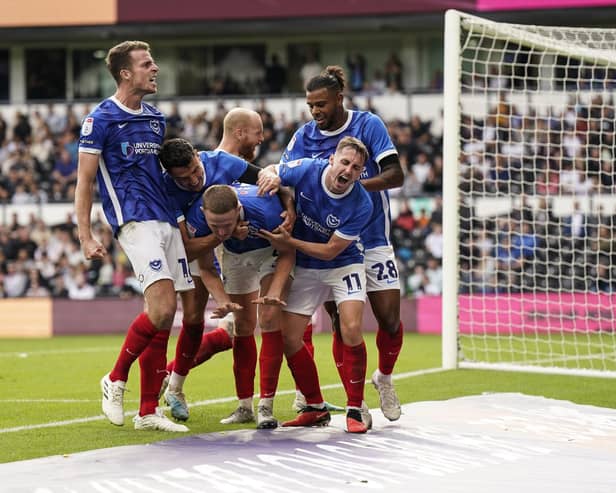 Pompey's players celebrate Colby Bishop's 95th-minute leveller at Pride Park. Picture: Jason Brown/ProSportsImages