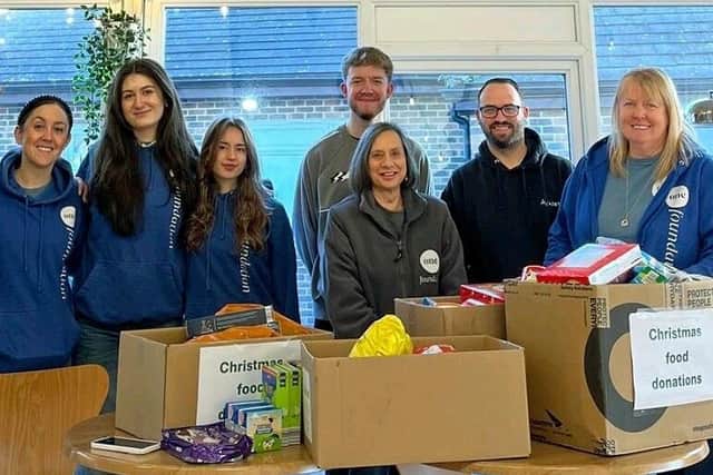HANDOVER DAY: Dom Currie, Azets Associate Director based in Portsmouth, is pictured, second right, dropping off Azets’ Portsmouth and Havant offices’ donations to One Church Foundation volunteers, including Esther Ellis, left, who coordinates the project