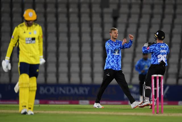 Danny Briggs of Sussex celebrates the wicket of James Vince with Ben Brown. Photo by Alex Davidson/Getty Images.