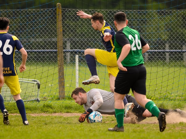 Action from Saturn Royale's 1-0 win over Pelham Arms (blue and yellow kit) in the second Adelaide Cup semi-final. Picture: Keith Woodland (300421-520)