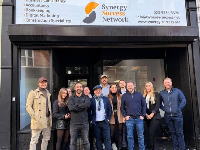 The Synergy Success Network Team at their New Hub Ribbon Cutting. From Left to Right: Paul Moody, Dolly Legg, Jackie Legg, Mark Legg, Shearon Scott, Gethin Jones, Joel Kirby, Chloe Legg, Jack Hawley CA, Lewis Filer, Lauren Pitt and Kyle Legg.