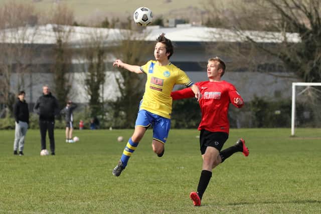 Meon Milton's Dylan Futcher, left, in action against Wymering. Pic: Kevin Shipp.
