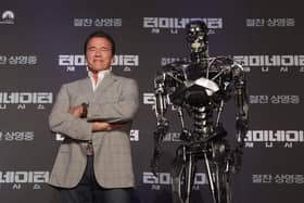 'The Terminator' (left) who was played on film by Arnold Arnold Schwarzenegger. Photo: Chung Sung-Jun/Getty Images.