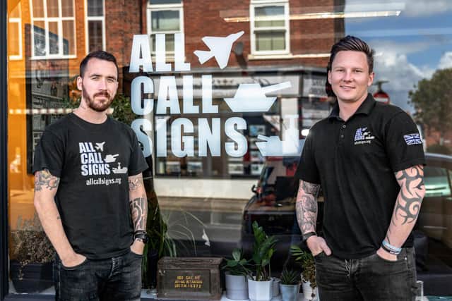Stephen James, left, and Dan Arnold, right, founders of All Call Signs. They are pictured outside their base in Albert Road, Southsea. Photo: Ellie Osborne.