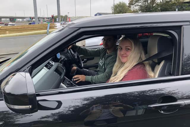 Jason Foreman, 23, and partner Taylor Hutton, 22, are driving from Southsea to Jasons home town of Peterborough.They spoke to The News while queuing at the Shell petrol station. Picture: Richard Lemmer