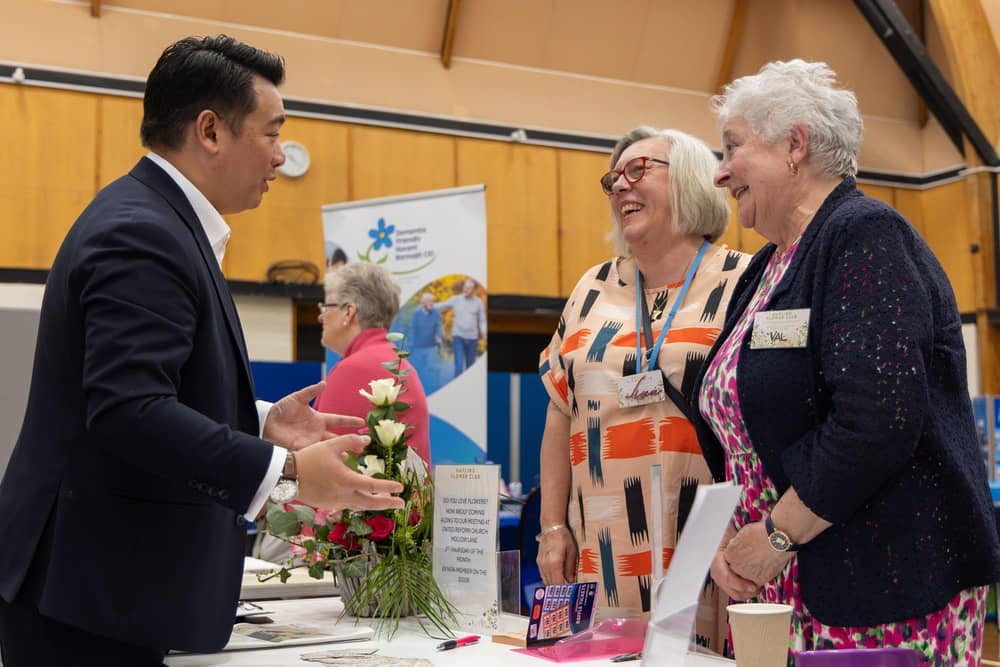 Alan Mak MP chats with Liza Bailey and Valerie Wallington from Hayling Flower Club
