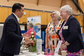 Alan Mak MP chats with Liza Bailey and Valerie Wallington from Hayling Flower Club