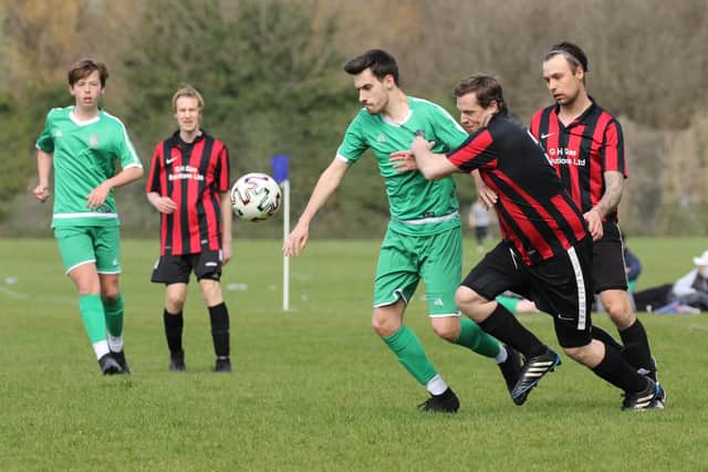 Action from Carberry (red/black) v Cowplain in the Mid-Solent League at King George V, Cosham. Picture: Kevin Shipp.