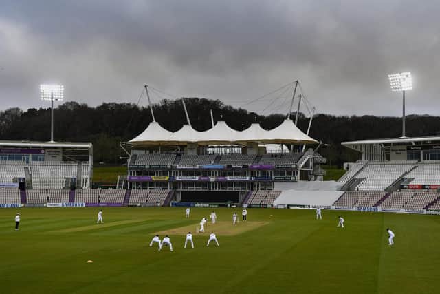 Cricket in March in England - The Ageas Bowl lights are on in  the evening session as Northants bat against Hampshire. Photo by Mike Hewitt/Getty Images.