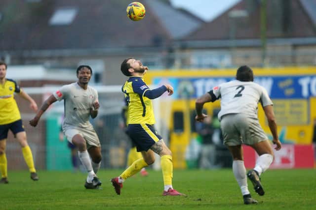 Gosport Borough striker Dan Wooden keeps an eye on the  ball against Walton Casuals. Picture: Chris Moorhouse