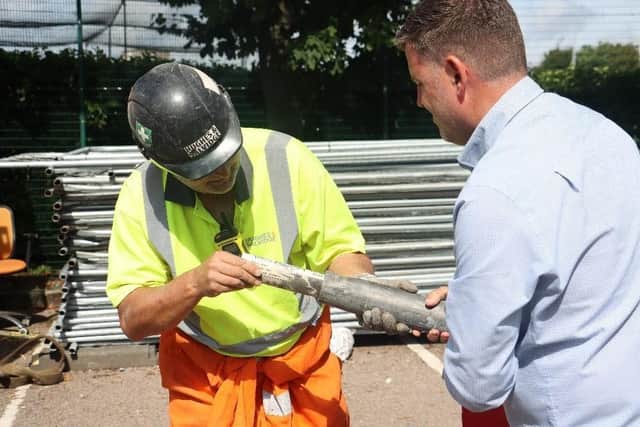 Demolition site manager Nathan Byng opening the time capsule. Picture: University of Portsmouth.