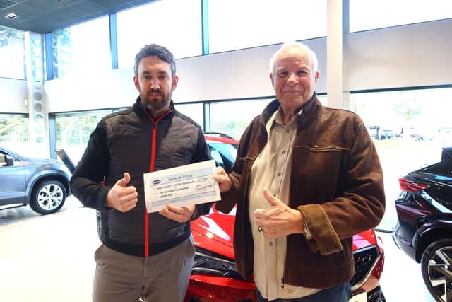 Peter Hallett, right, receives his £2,500 cheque from Glenn Poate, Sales Manager at Snows CUPRA Portsmouth