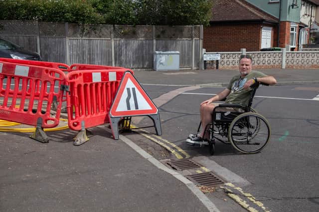 Steven says something must be done soon to repair the road as it poses a danger to pedestrians. Picture: Habibur Rahman