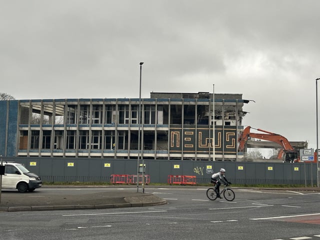 The moment just before the 'News' mosaic was demolished
