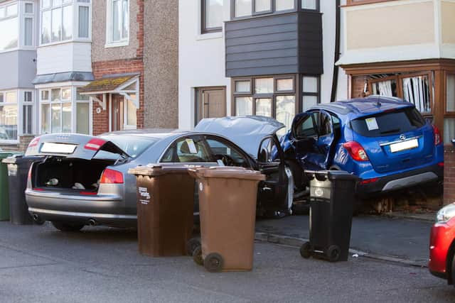 Pictured: Police presence on Kensignton Road with 2 damaged cars against a house. Picture: Habibur Rahman