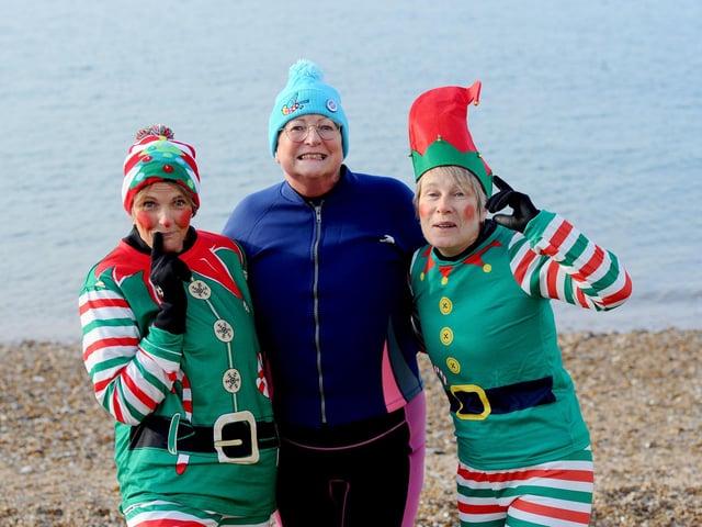 Rachel Ramshaw, Mandy Gillan and Esther Kent, all from Gosport, took part in the Boxing Day dip. Picture: Sarah Standing (261224-468)
