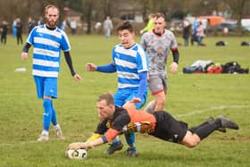 The Gosham Rangers keeper pounces on the ball. Picture: Keith Woodland